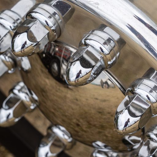 Closeup shot of a shiny metal hub of a car A closeup shot of a shiny metal hub of a car